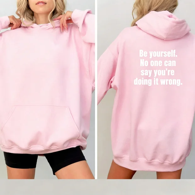 Fun hooded sweatshirt with slogan "Be yourself. No one can say you're doing it wrong"